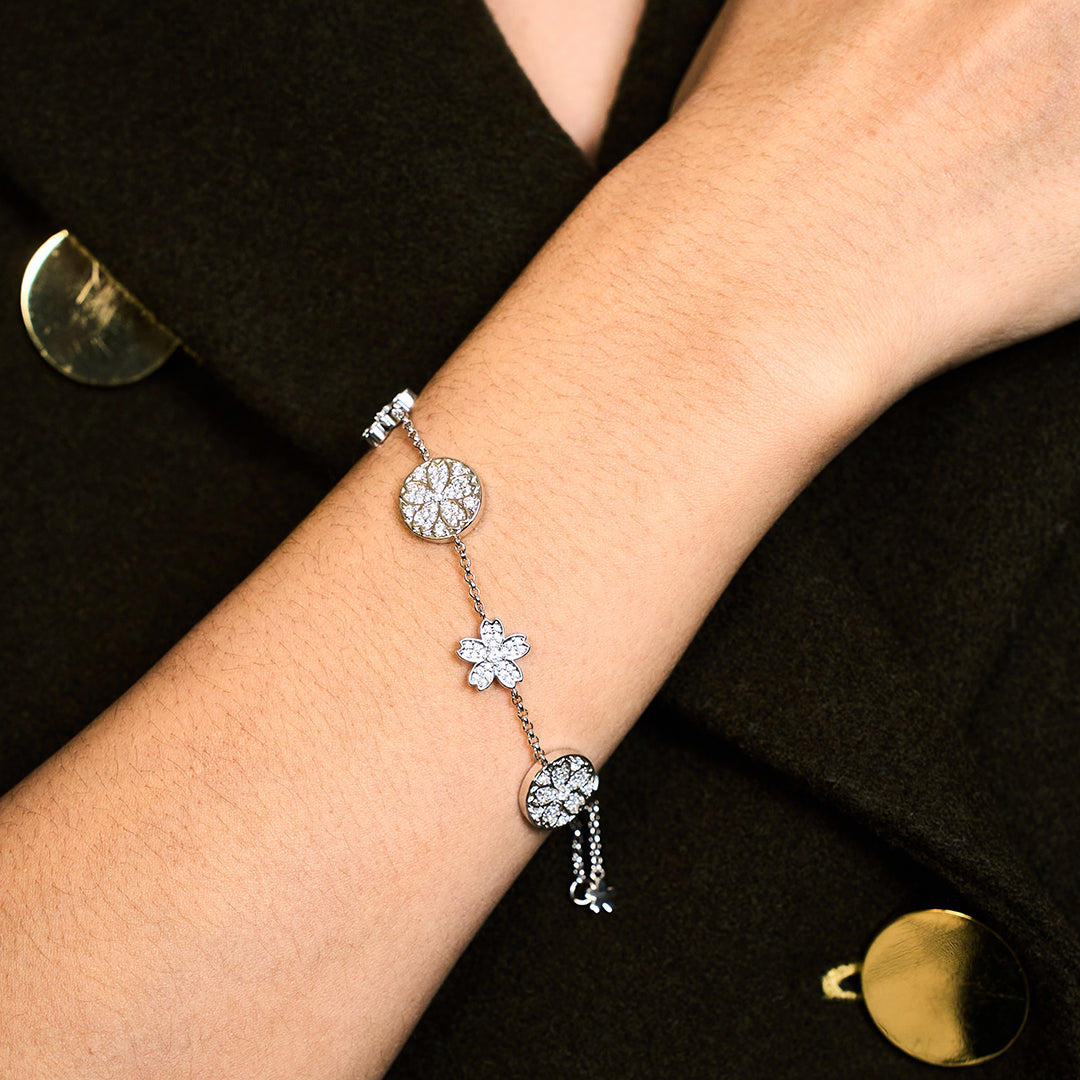 Cherry Blossom Symphony Pavé 7-Flower Zirconia Silver Station Bracelet (Platinum Plated)