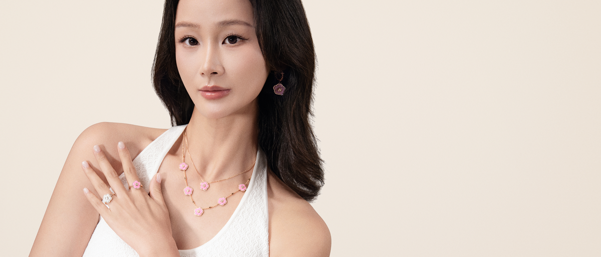 Model wearing Cherry Blossom necklaces, rings and earrings